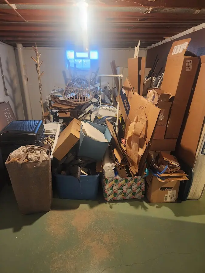 Roll-off dumpster container at job site for Yard Waste Dumpster Rental in Champlain